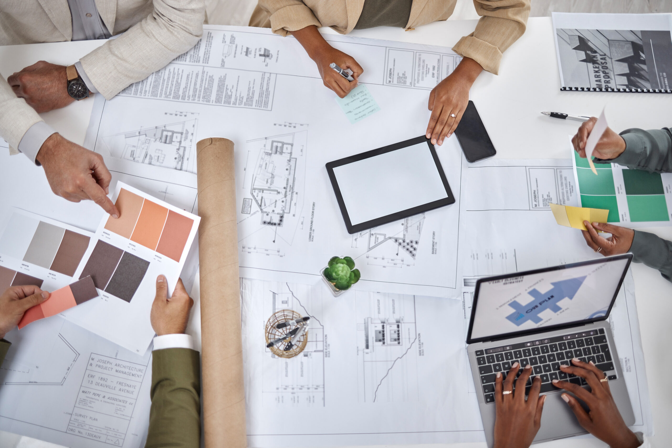 Architect, hands and blueprint design in meeting above for planning, strategy or architecture on of.